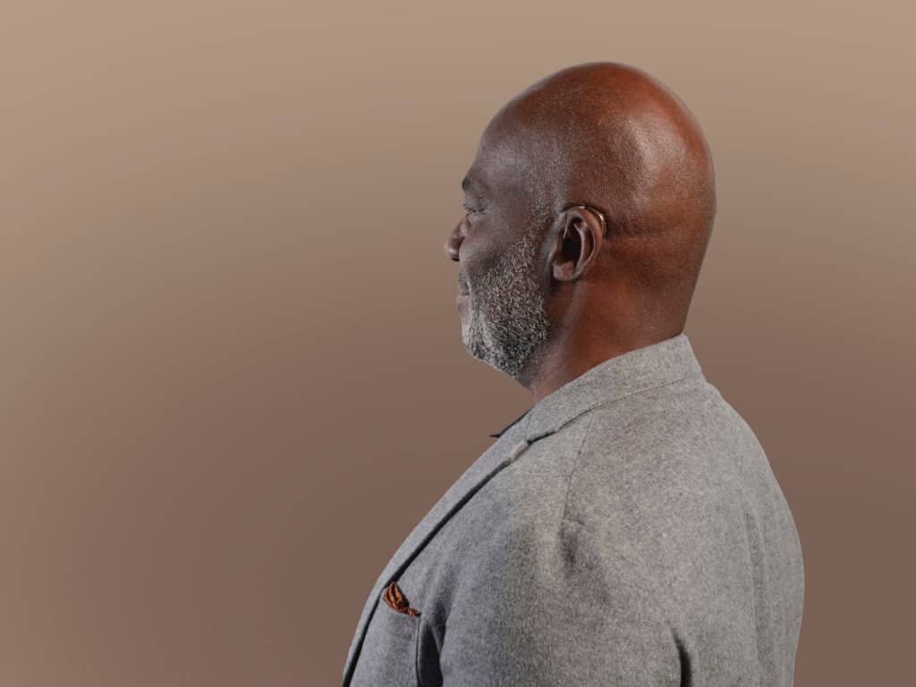 Patient wearing a Discreet, digital hearing aids