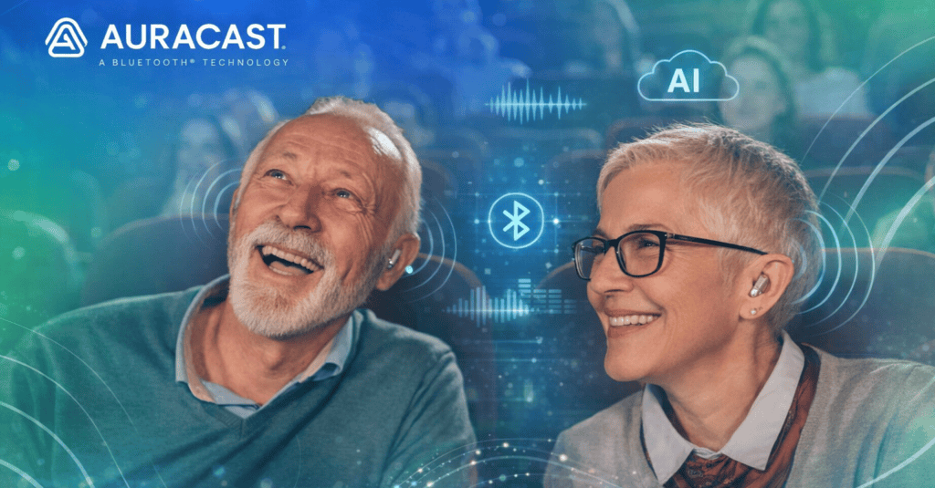 Older couple enjoying a theatre performance with discreet hearing aids, enhanced by Auracast Bluetooth technology.
