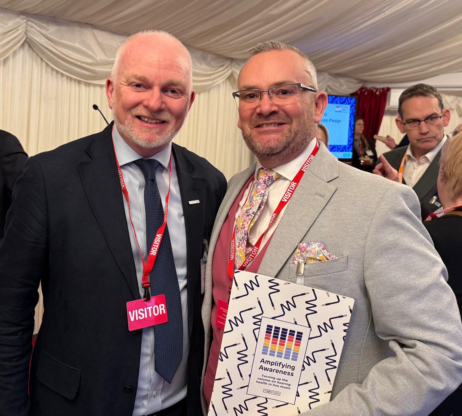 Michael Marchant with Tinnitus UK CEO Alex Brooks‑Johnson at the House of Lords, February 2026