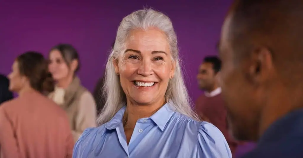 Lady smiling wearing Oticon Hearing Aids