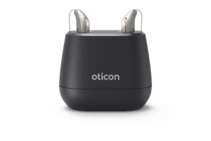 Rechargeable RIC hearing aids in light silver.