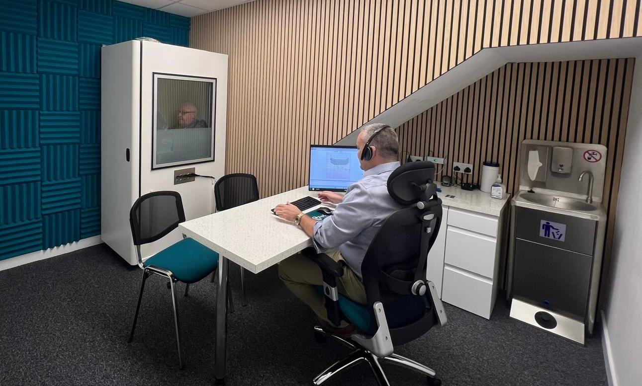 Michael Marchant conducting a hearing test at Audibility Hearing Centre in Motherwell